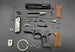 1:3 Beretta 92FS Handgun - Desert Tan miniature model disassembled with all die cast metal parts and tan grips displayed.