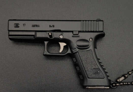 Black handgun with visible brand logo on a dark background
