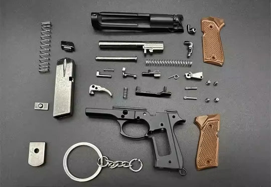 1:3 Beretta 92FS Handgun - Desert Tan miniature model disassembled with all die cast metal parts and tan grips displayed.
