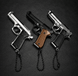 Three small guns with chains on a dark background