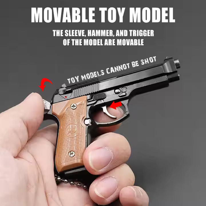 1:3 Beretta 92FS Handgun - Black miniature with movable sleeve, hammer, trigger, and tan grips held in hand.