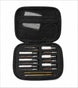 An open black zippered carrying case displaying a cleaning tool kit with various metal and bristle brushes, pins, and rods organized in a foam insert, set against a plain white background.