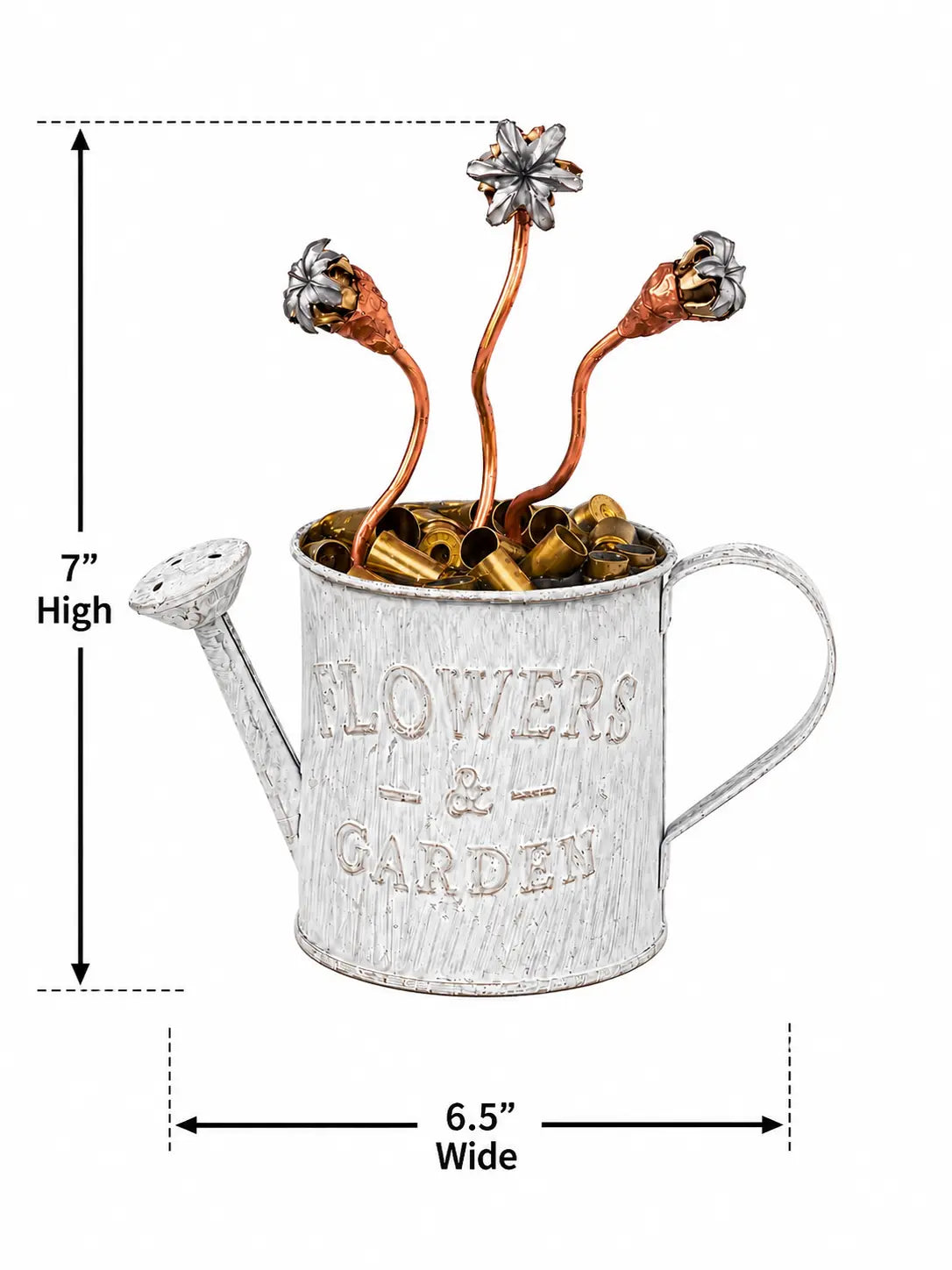 A decorative metal watering can garden ornament with embossed 'FLOWERS & GARDEN' text, filled with small flower buds and stems, shown with dimension arrows indicating 7 inches high and 6.5 inches wide on a white background.