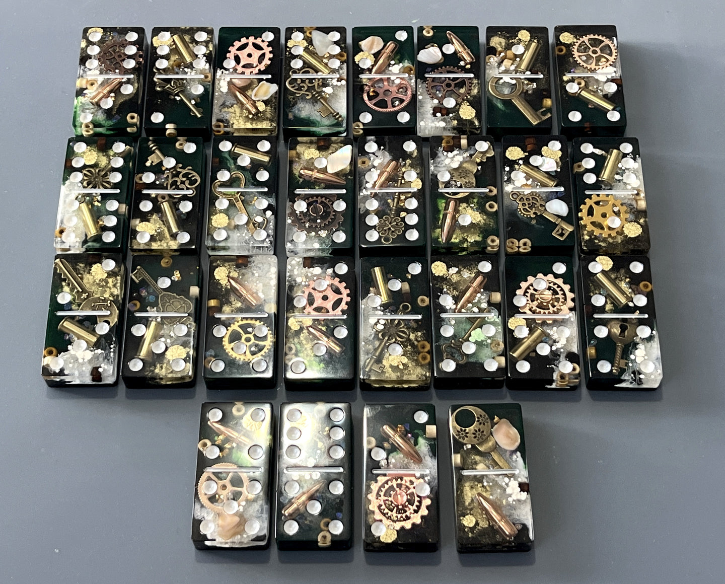 Bullets and Casings Dominos Double 6 Set with 28 handmade pieces featuring bullet casings and gears design.