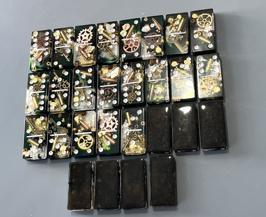 Bullets and Casings Dominos Double 6 Set featuring 28 unique handmade domino pieces with embedded brass and silver accents.