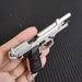 1:3 Beretta 92FS Handgun - Silver miniature model with detailed metal parts and black grips shown in hand.