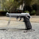 1:3 Beretta 92FS Handgun - Silver miniature model with die cast metal parts and working thumb safety and slide.