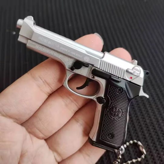 1:3 Beretta 92FS Handgun - Silver miniature model with working safety, slide, and loadable dummy magazine in hand.