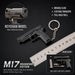 Black metal keychain model of a handgun, shown with a ruler for scale, product features text, and an inset showing included parts.