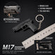 Black metal keychain model of a handgun, shown with a ruler for scale, product features text, and an inset showing included parts.
