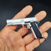 1:3 1911 Scale Handgun - Silver miniature model with die cast metal parts, functional safety, and slide in hand.