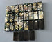 Bullets and Casings Dominos Double 6 Set featuring 28 unique handmade domino pieces with embedded brass and silver accents.