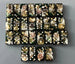 Bullets and Casings Dominos Double 6 Set with unique handmade pieces featuring bullets and gears on black tiles.