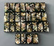 Bullets and Casings Dominos Double 6 Set with unique handmade pieces featuring bullets and gears on black tiles.