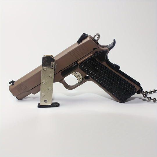 1:3 1911 Scale Handgun - Desert Tan miniature with die cast metal parts, working thumb safety, and slide action.