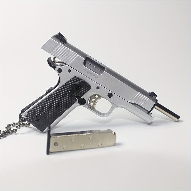 1:3 1911 Scale Handgun - Silver miniature die cast model with working safety, slide, and removable magazine.