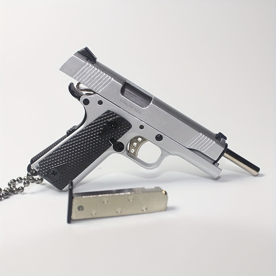 1:3 1911 Scale Handgun - Silver miniature die cast model with working safety, slide, and removable magazine.