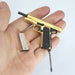 1:3 1911 Scale Handgun - Gold miniature with black grips and detachable magazine held in a hand.