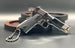 1:3 1911 Scale Handgun - Shiny Silver miniature die cast metal model with black grips and working parts on display.