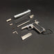 1:3 1911 Scale Handgun - Silver miniature die cast metal model with disassembled parts on black background.